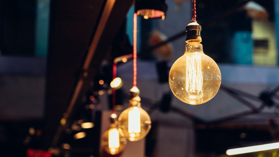 Three light bulbs handing from ceiling