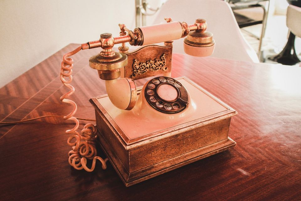 Old fashioned telephone on table